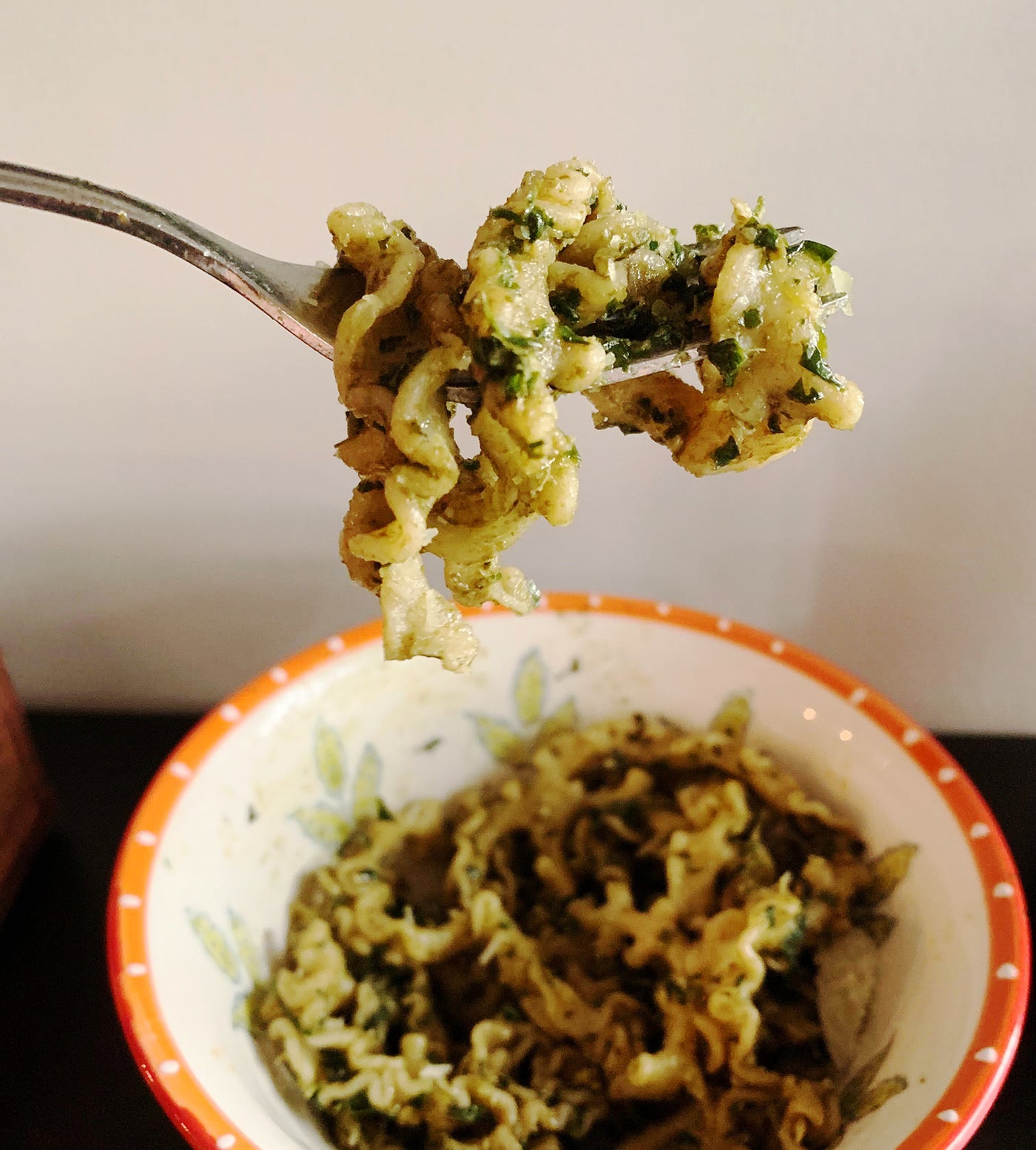 Photo of a fork lifting a bite of Foggy Mountain Pasta with pesto sauce