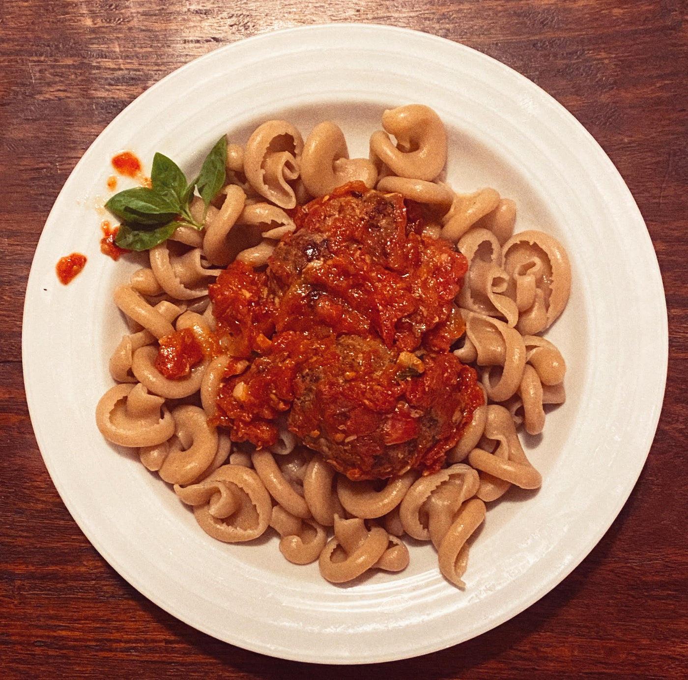 Image of Foggy Mountain Pasta's dried Girelle Pasta prepared with a red sauce and meatballs from the Organic Butcher of McLean.